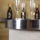 Circular bar in brushed metal, wood and carpet. 1970s.
