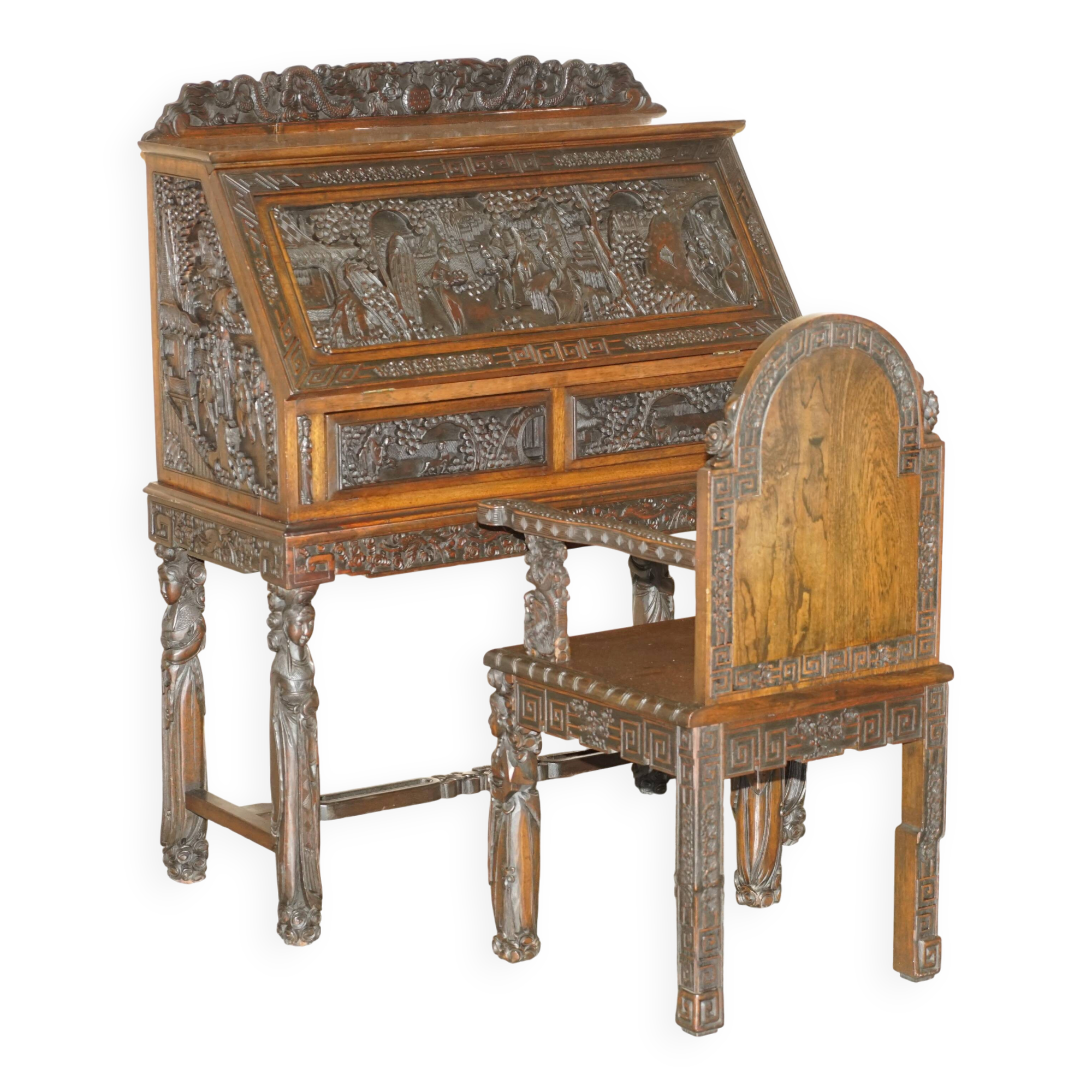Chinese hand-carved desk from around 1940 with matching chair.