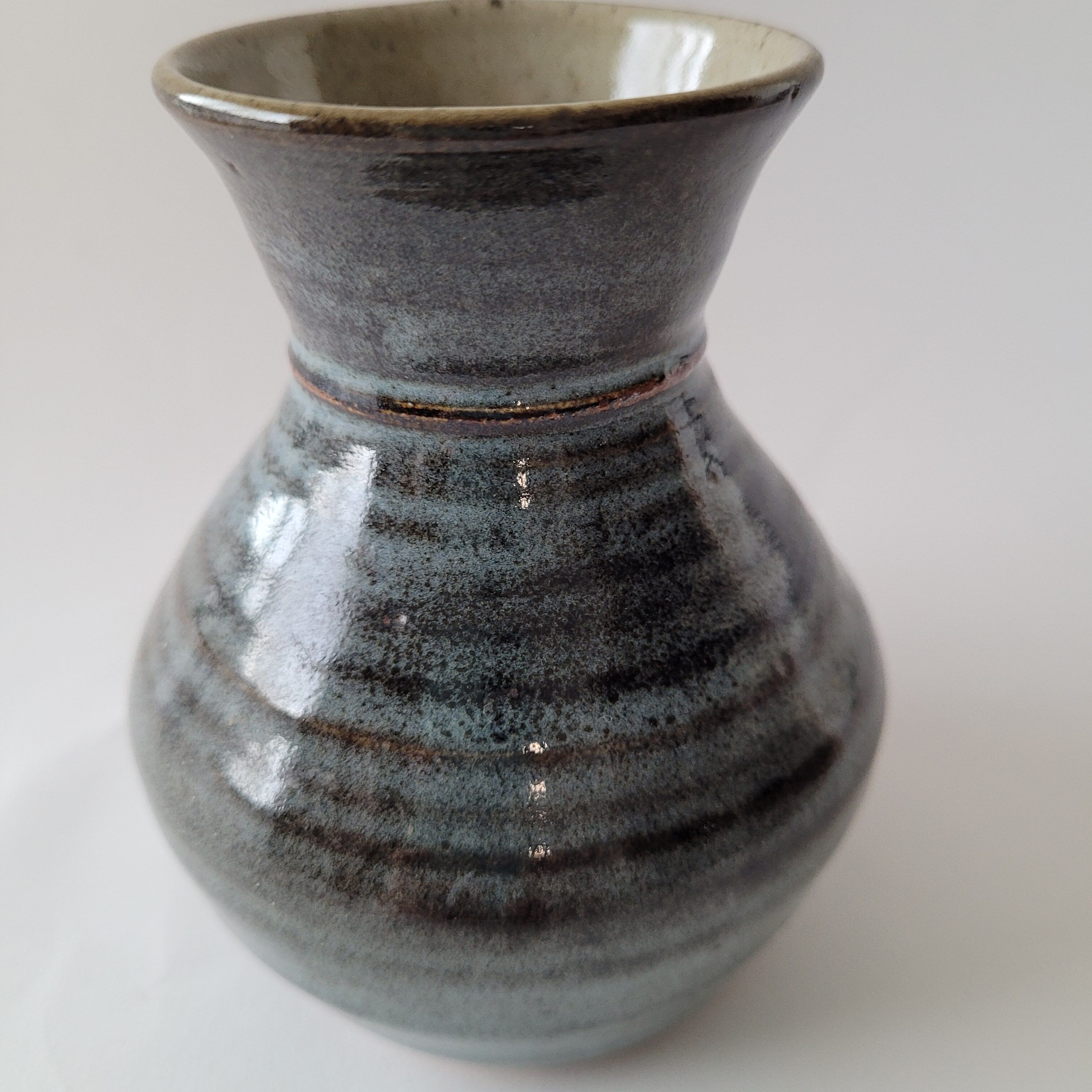 Small blue enamelled vase