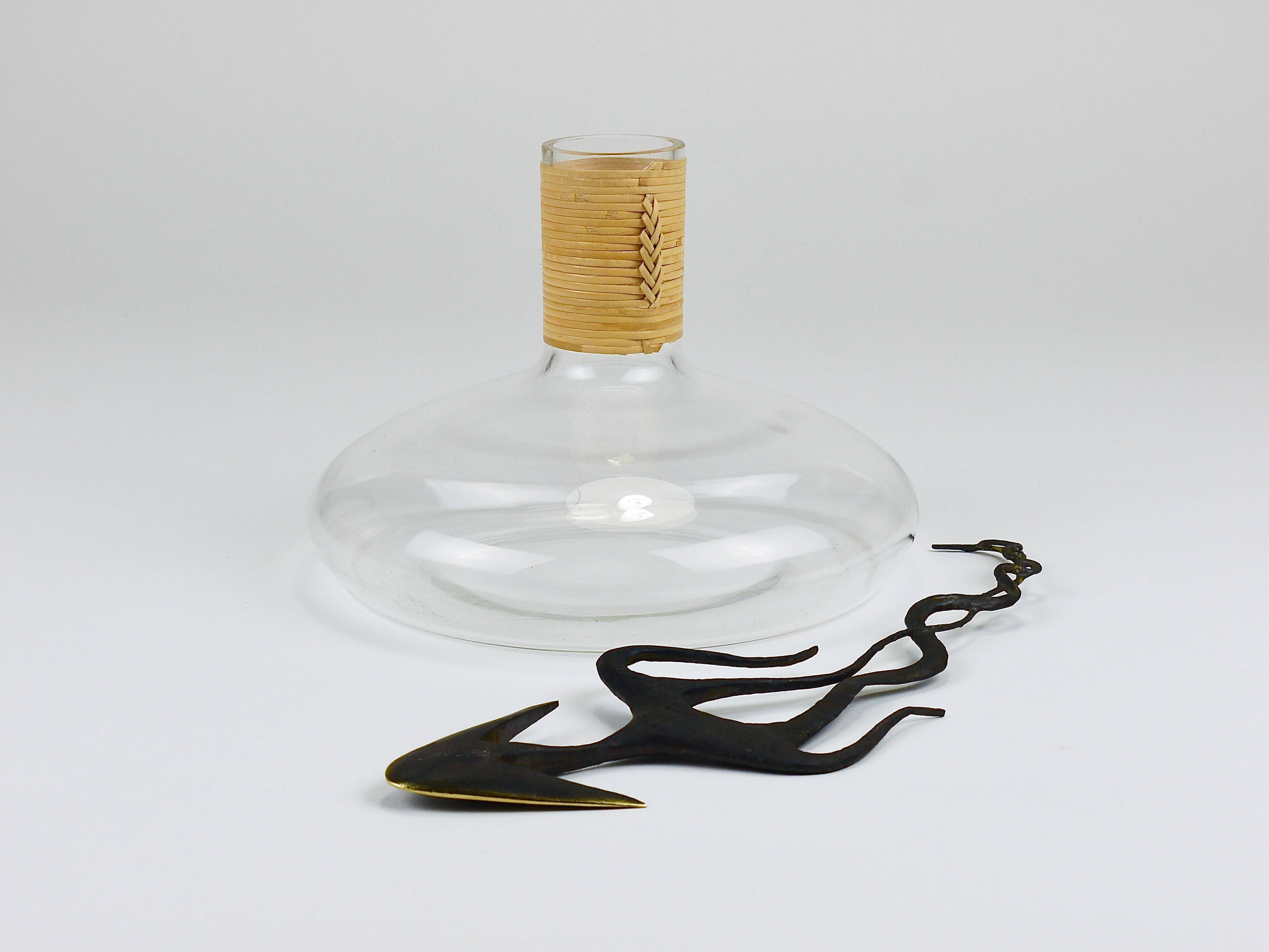 Vase by Carl Auböck decanter "Tuberkulinkolben" tall in rattan, Austria, 1950s.