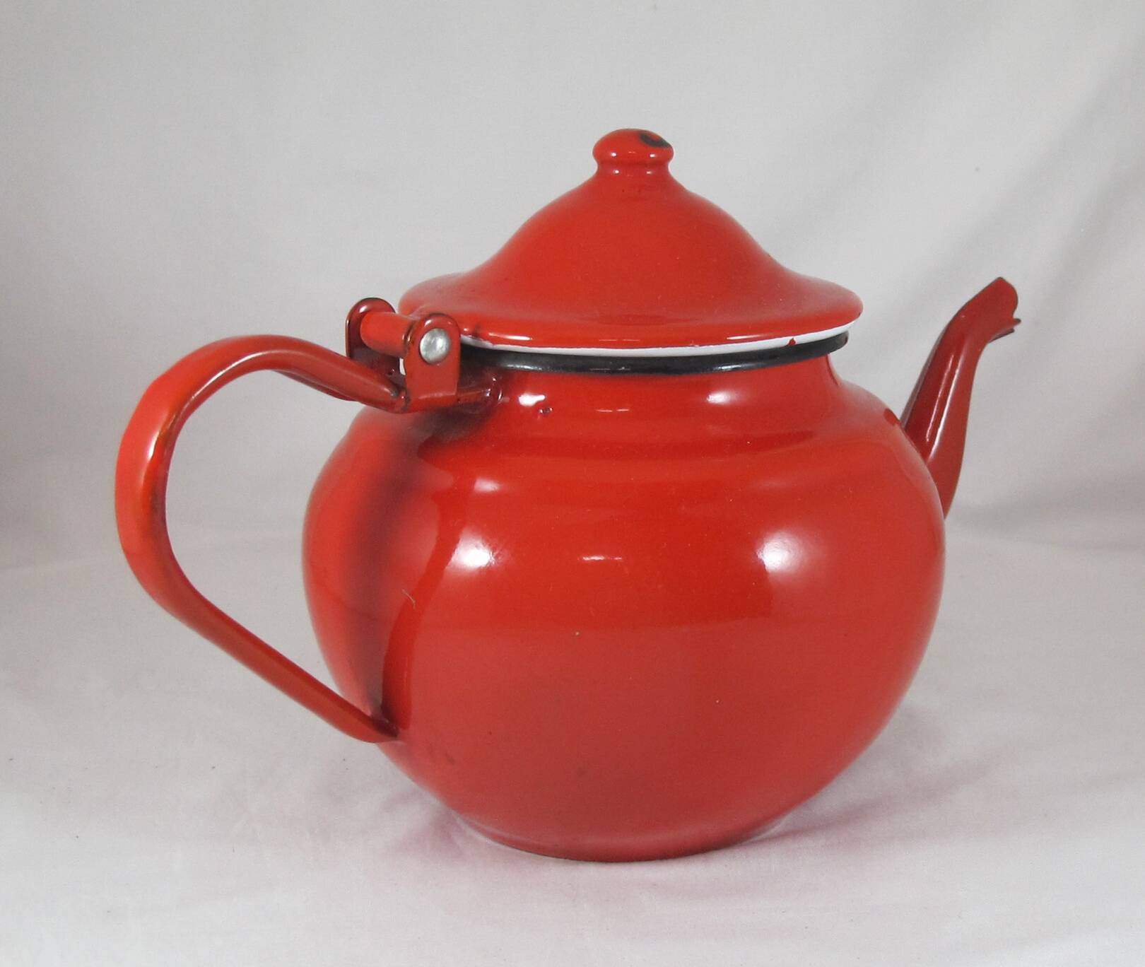 Vintage teapot coffee maker in red enameled metal