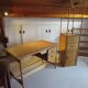 Storage column, wooden bookshelf and woven rattan.