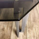 Brushed stainless steel design side table and 70s smoked glass