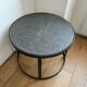 Round coffee table in natural stone and metal – contemporary design