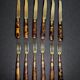 Table art, 12 fruit cutlery sets in gilded metal with horn from the early 20th century.