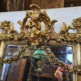 Mirror with an angel in gilded wood and stucco 166x61cm