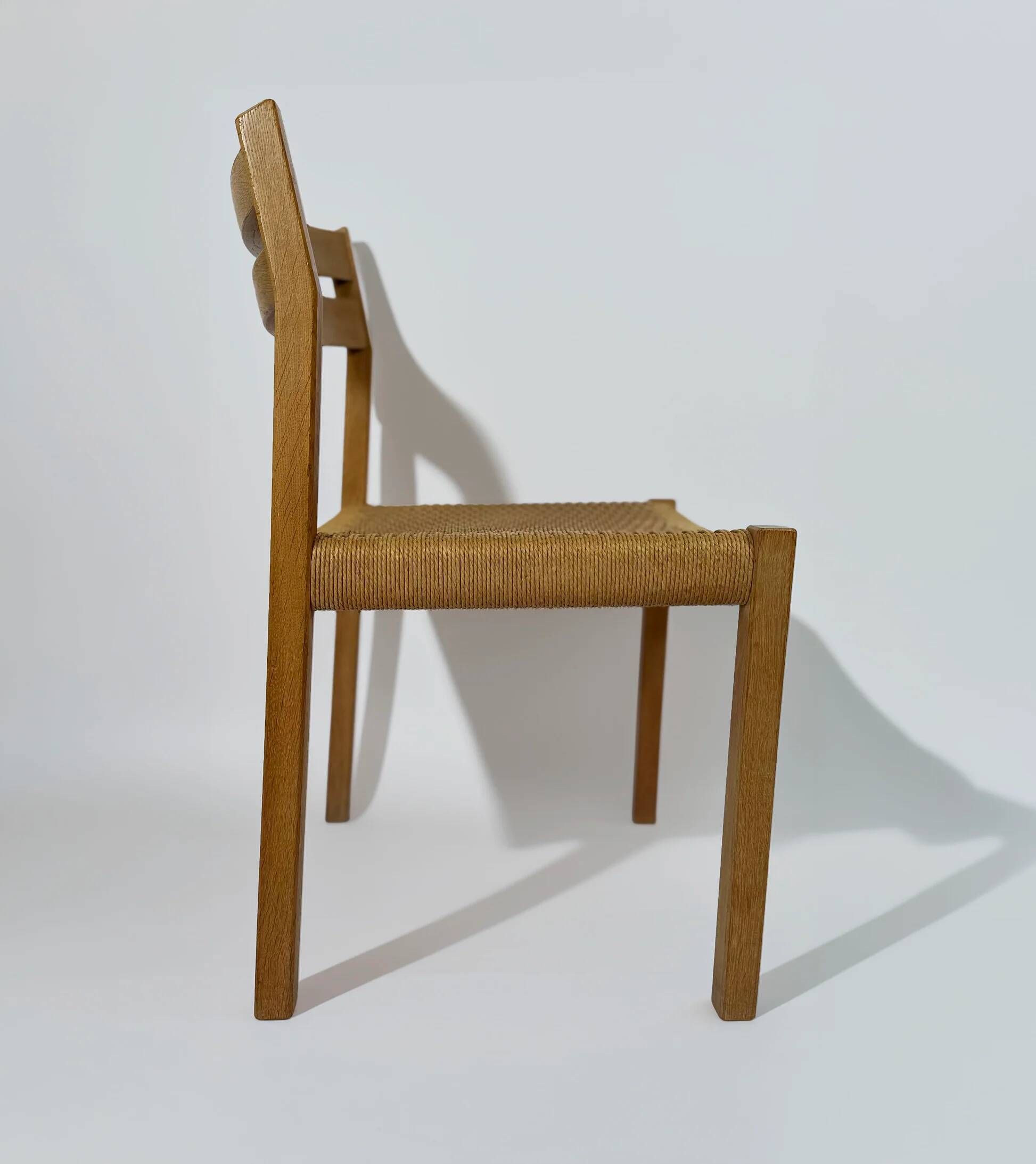 Dining chairs J.H. Møller model 401 in oak with original Danish cord — Denmark, 1970s