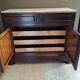 Victorian commode with a white marble top.