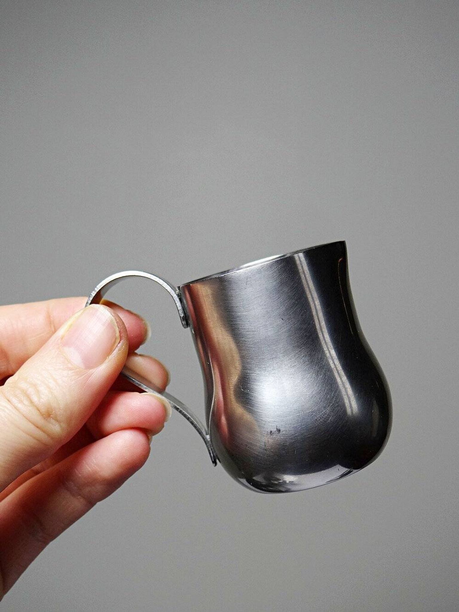 Set of 4 vintage bar measures in brushed stainless steel from the 60s-70s.