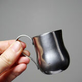 Set of 4 vintage bar measures in brushed stainless steel from the 60s-70s.