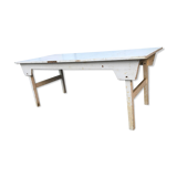 Old table in foldable wood painted white
