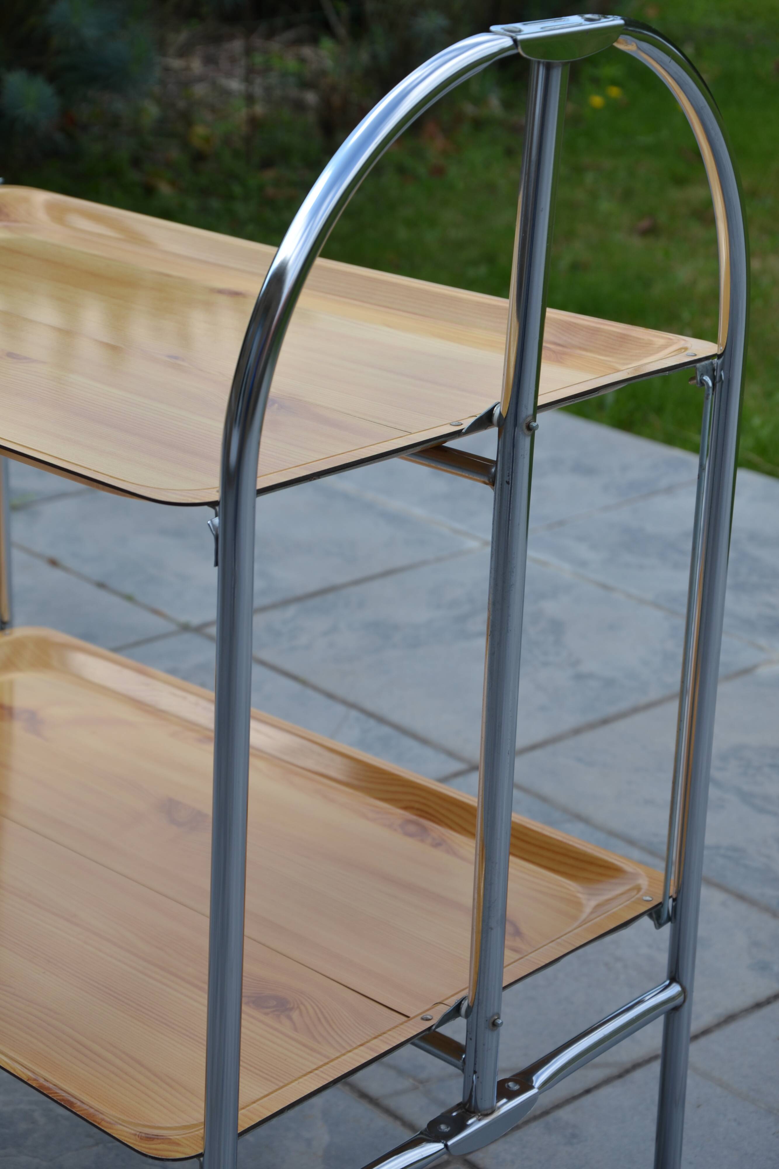 Folding dessert trolley on chrome metal wheels and formica.