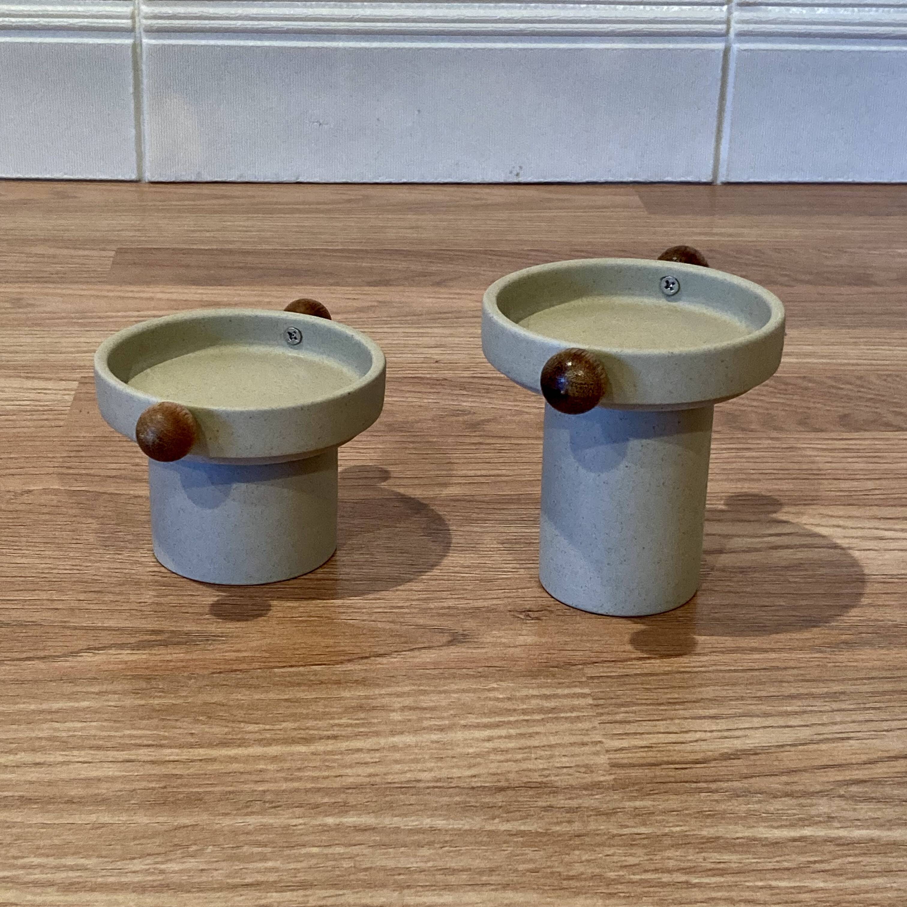 A pair of Scandinavian design candle holders.