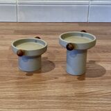 A pair of Scandinavian design candle holders.