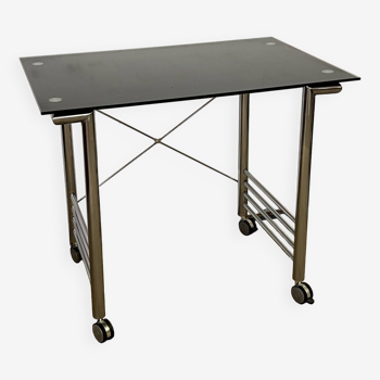 Small glass and chrome metal desk with vintage casters