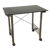 Small glass and chrome metal desk with vintage casters