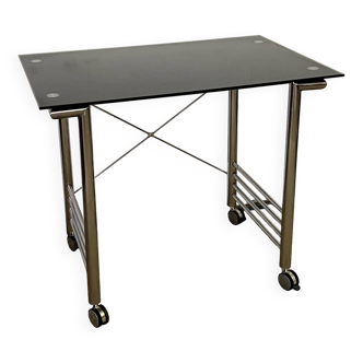 Small glass and chrome metal desk with vintage casters