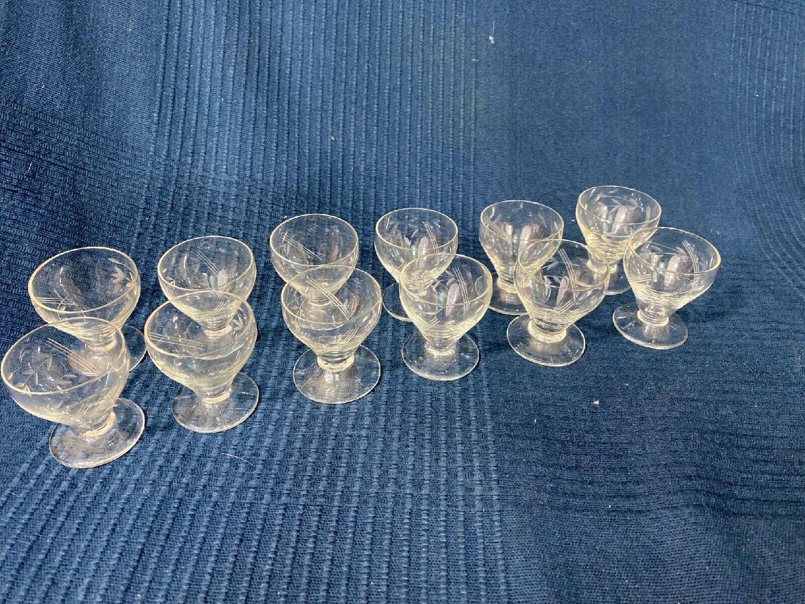 Set of 12 hand-sized crystal glasses with flower decoration