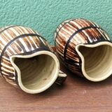 Pair of trompe l'oeil bistro pitchers, barrels