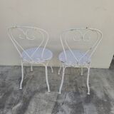 Pair of wrought iron garden chairs, antique manufacture
