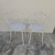 Pair of wrought iron garden chairs, antique manufacture