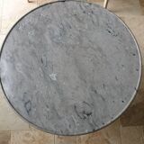 Pedestal table above marble