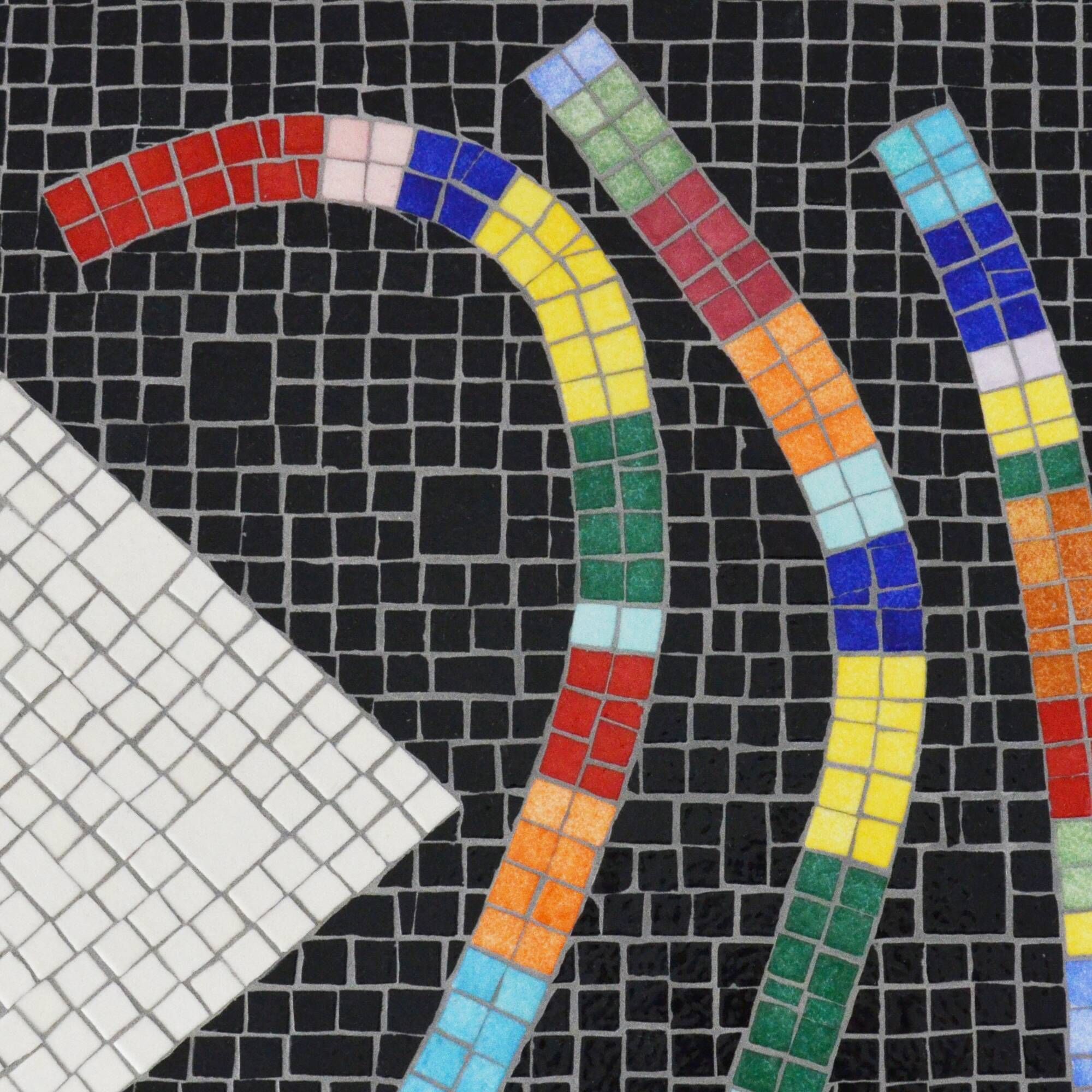 Table topped with a ceramic mosaic featuring an abstract design.