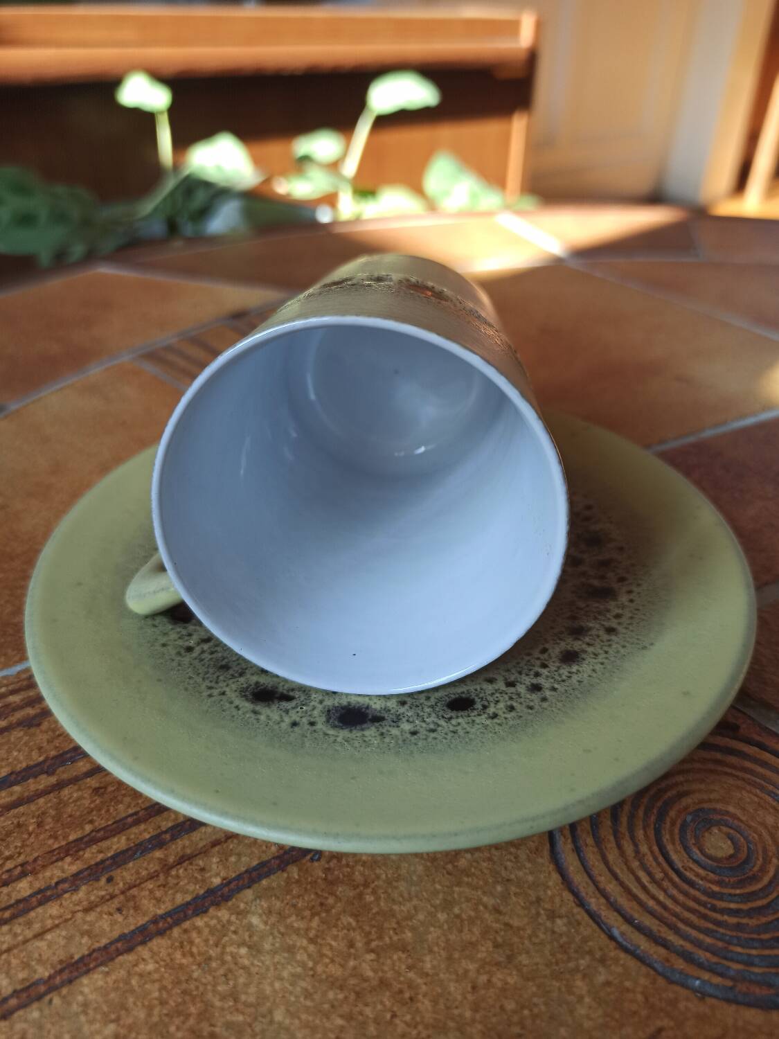 A pair of vintage glazed stoneware cups and saucers.