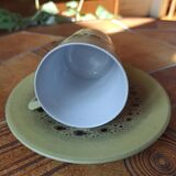 A pair of vintage glazed stoneware cups and saucers.