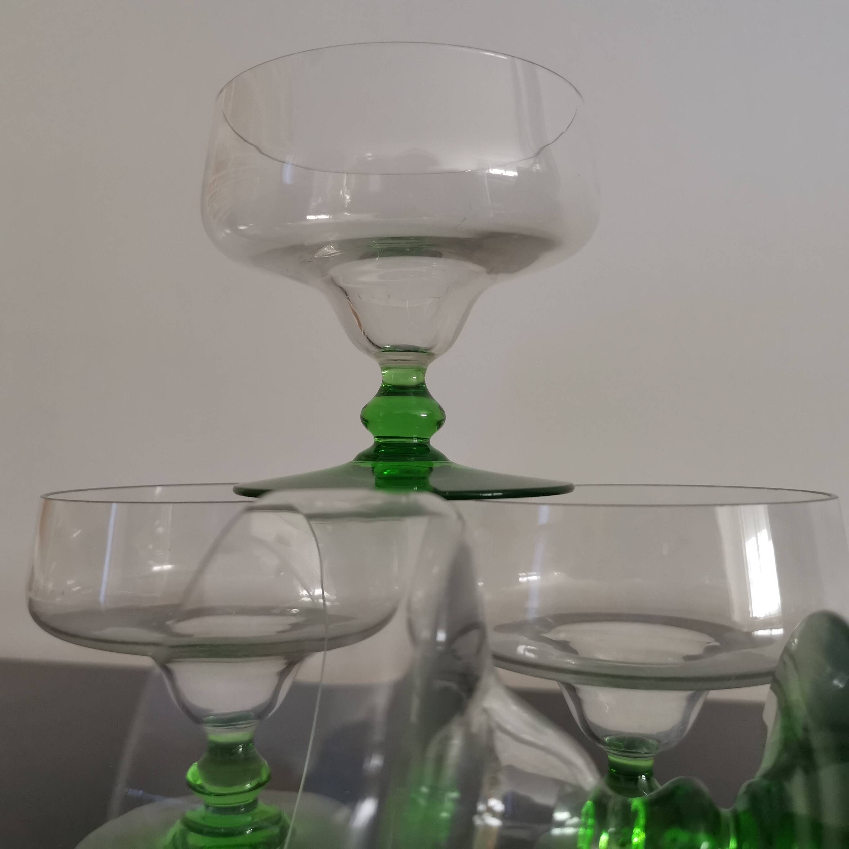 Set of 4 champagne glasses on green legs, 1960s