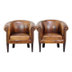 Set of 2 subtle, stately and sturdy club chairs made of sheepskin
