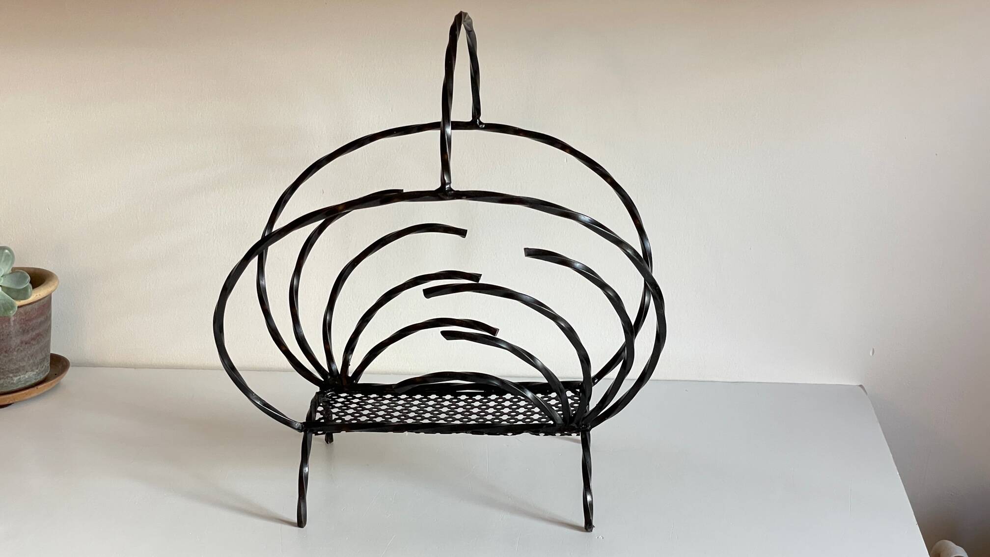 Vintage steel and rigitulle magazine holder
