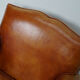 Vintage french moustache back cognac-colored leather club chair