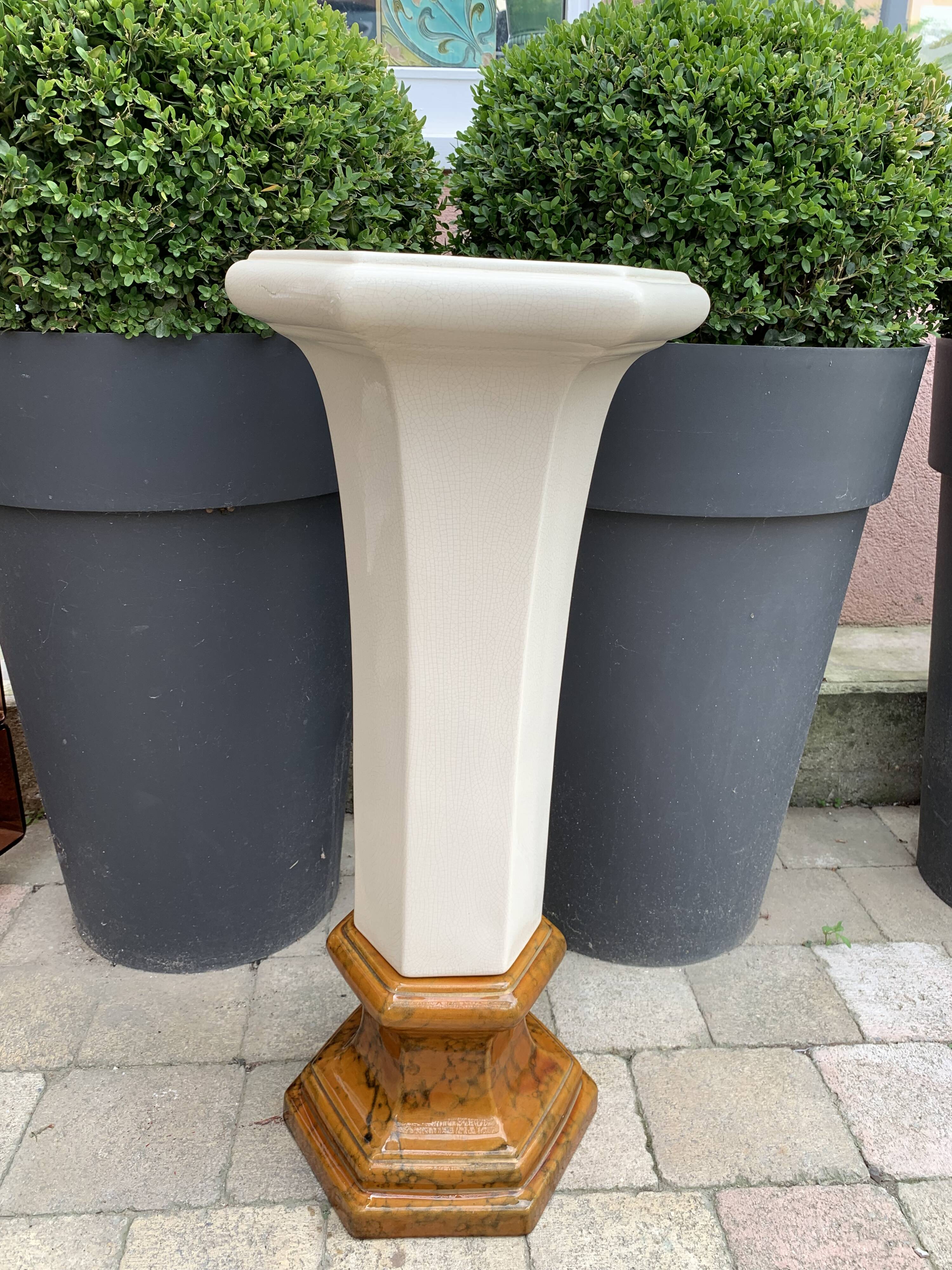 Column wears vintage plant