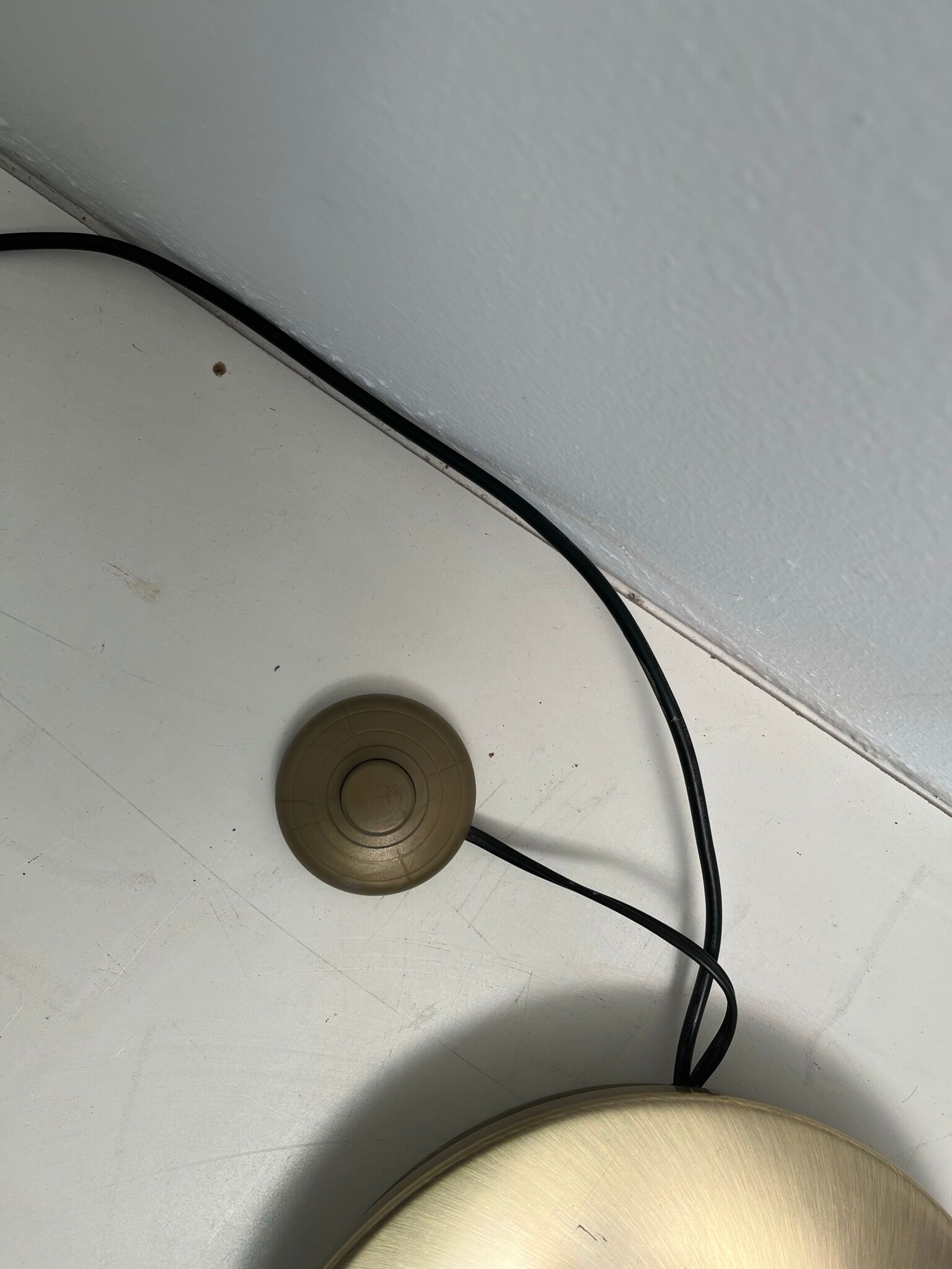 Golden metal floor lamp with reading light