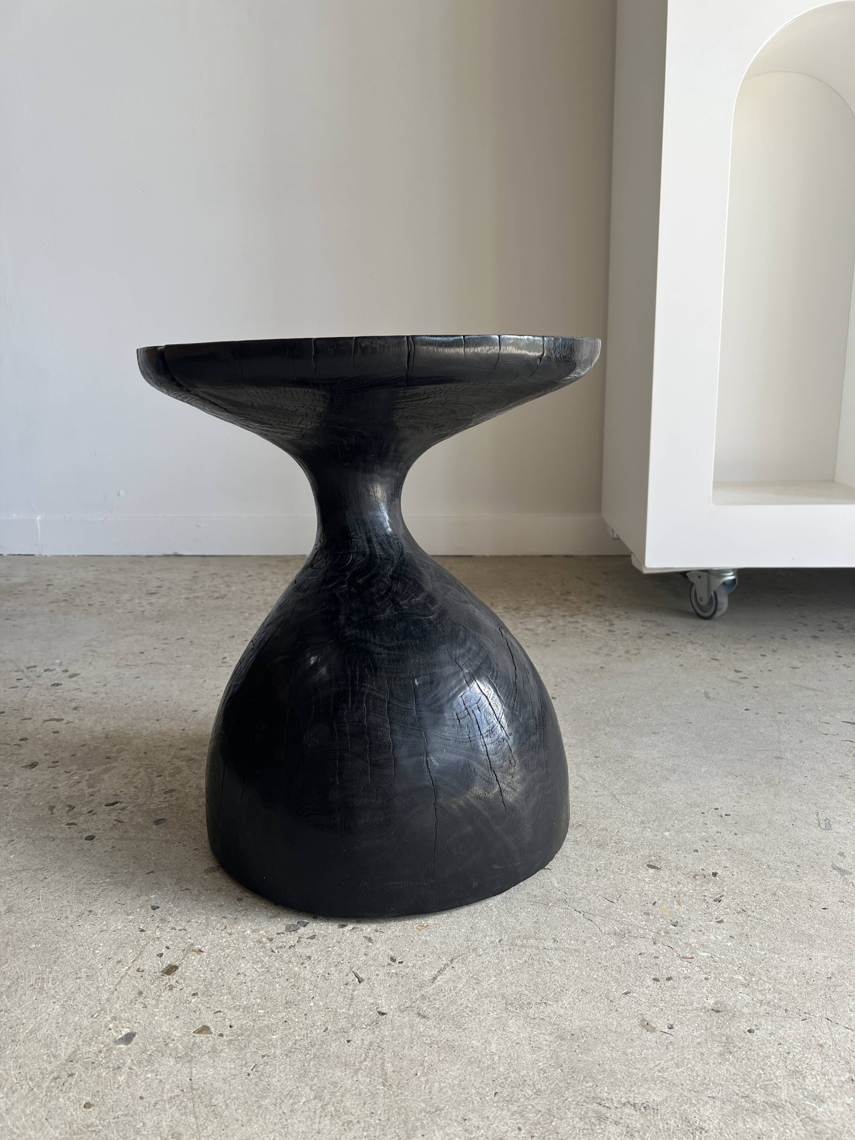 Solid wood (monoxyl) side table, organic shape, black color
