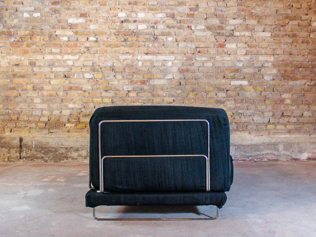 Black fabric design sofa with chromed steel frame