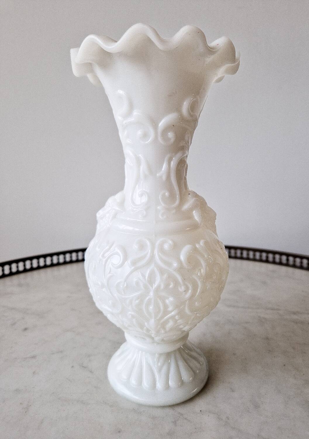 White opaline vase decorated with arabesques and ram's heads