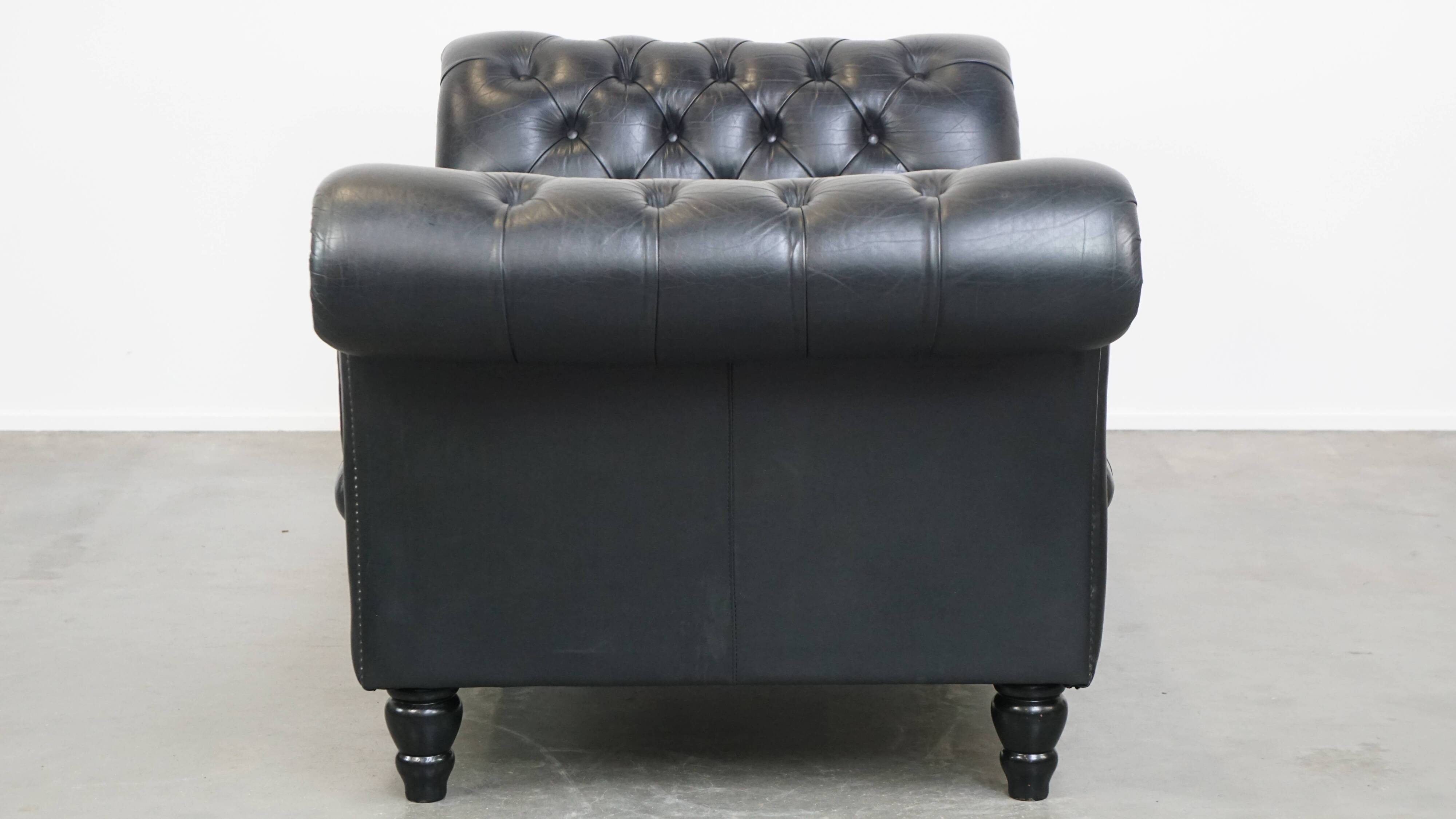 Black chesterfield daybed made of cowhide