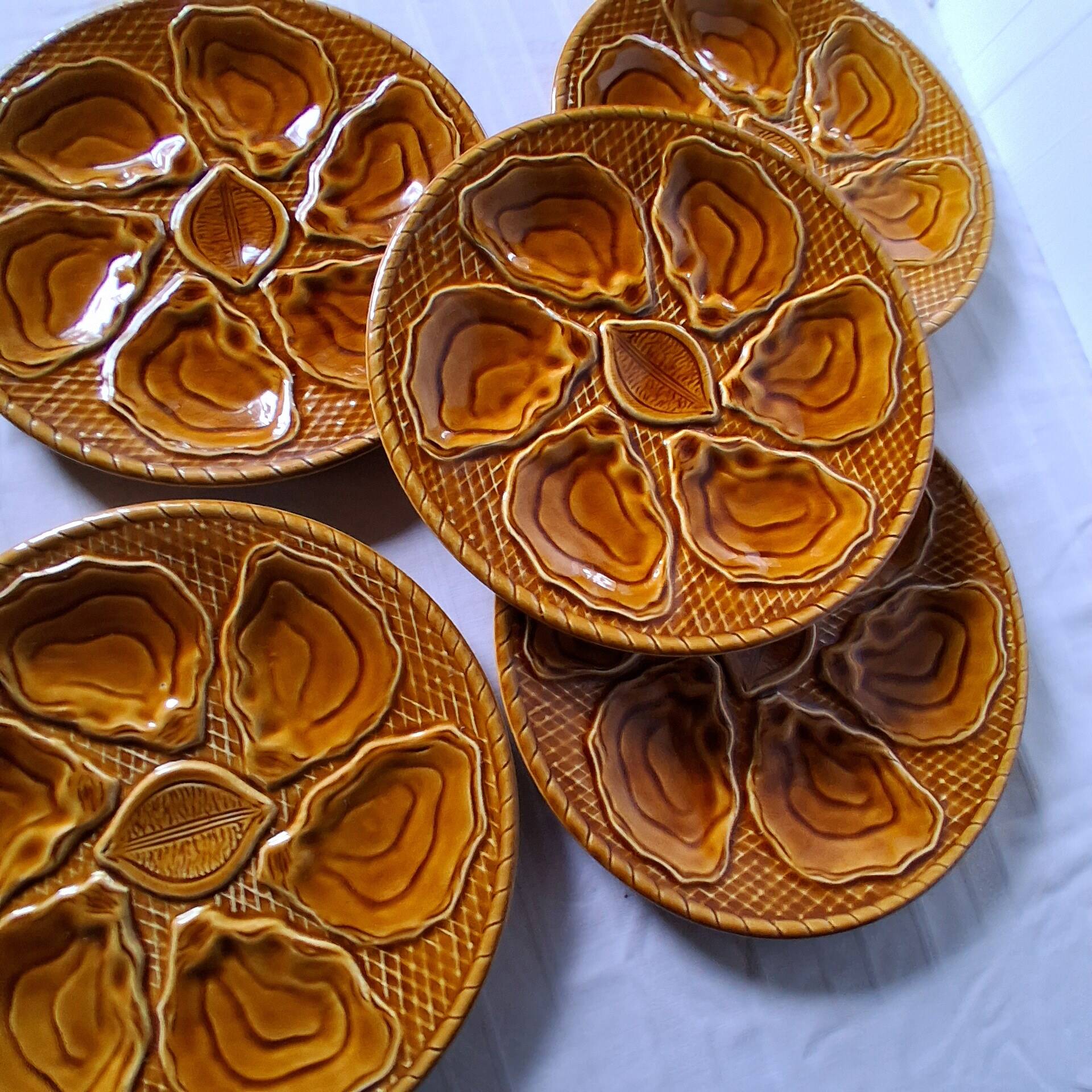 5 oyster or brown shell plates in good condition