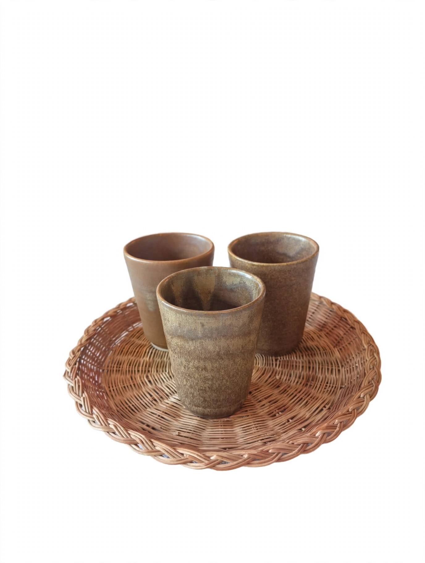 3 vintage 70s glazed stoneware cups and the wicker tray.