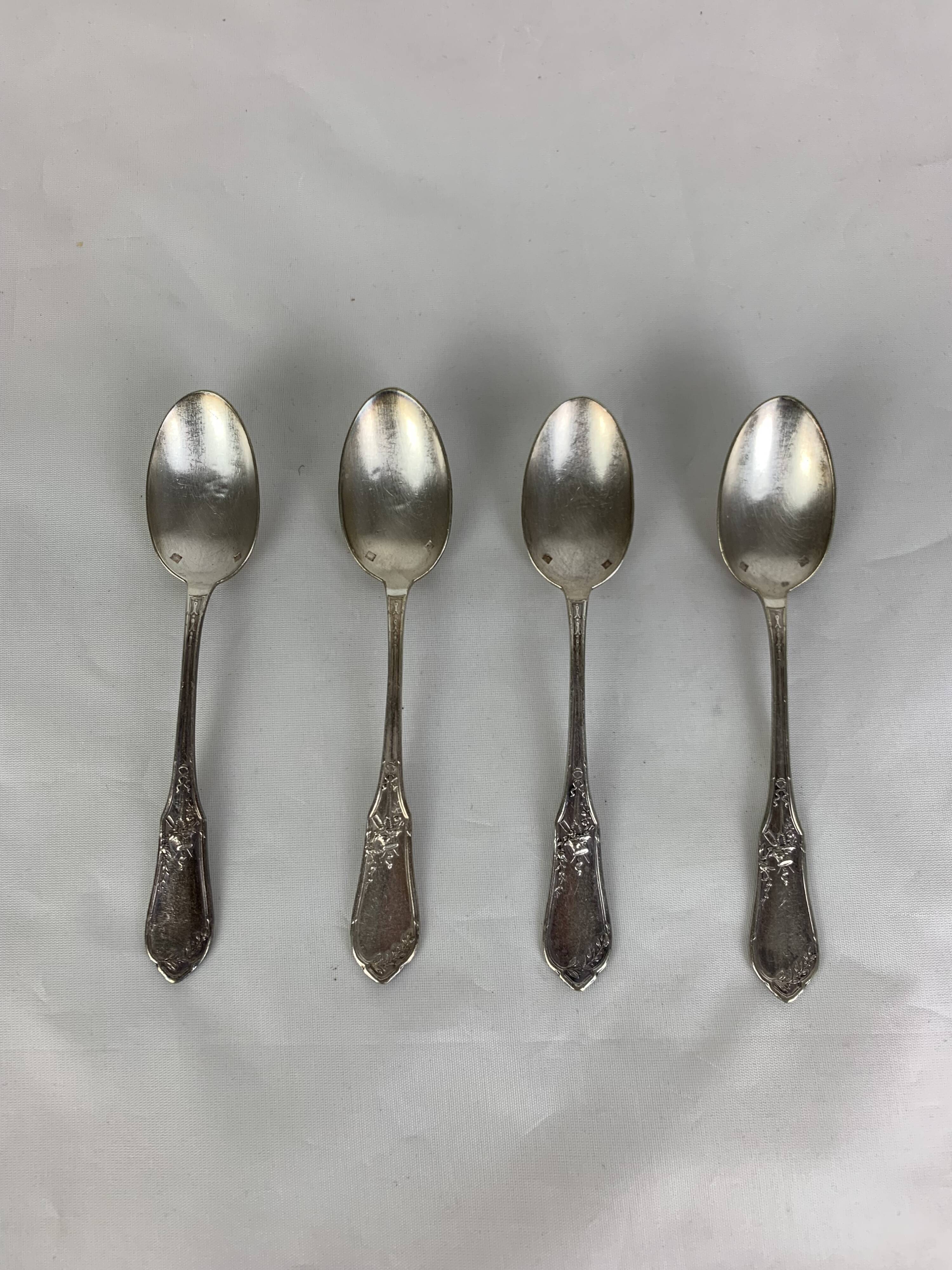 4 small silver metal spoons
