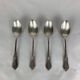 4 small silver metal spoons