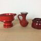 3 red ceramic vases