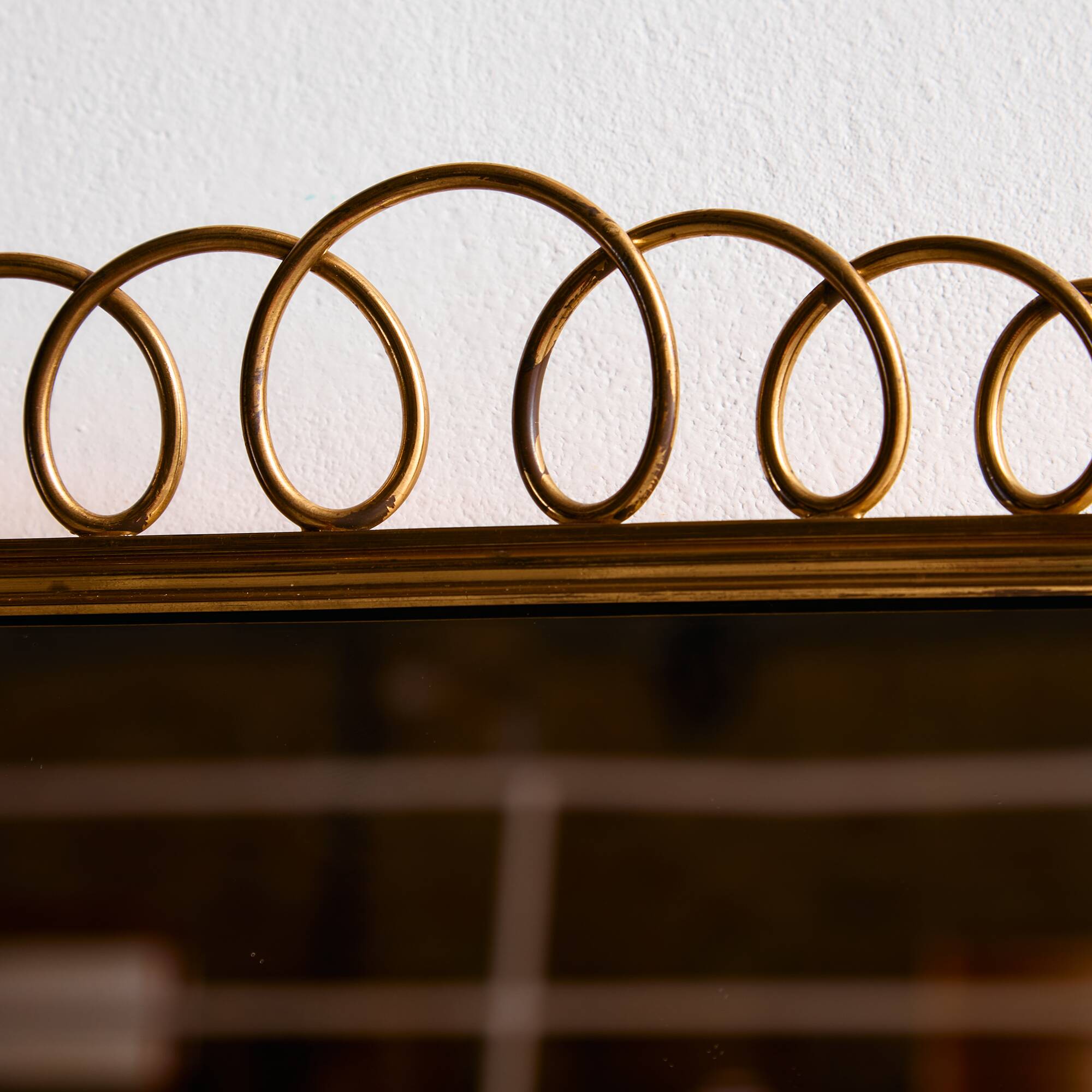 Metal and brass framed mirror