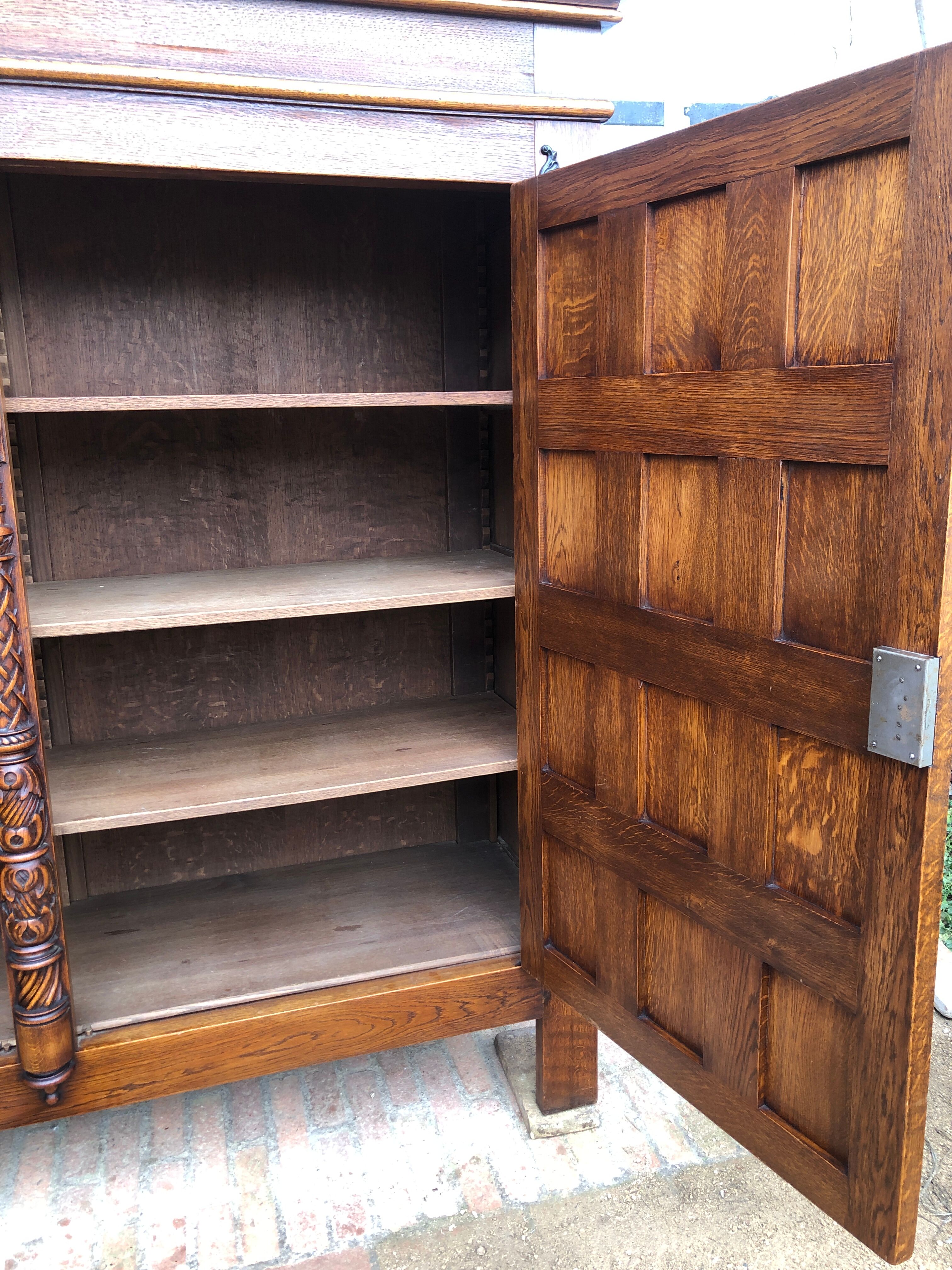 Spanish furniture with carved wood profiles and coats of arms from the 1950s.