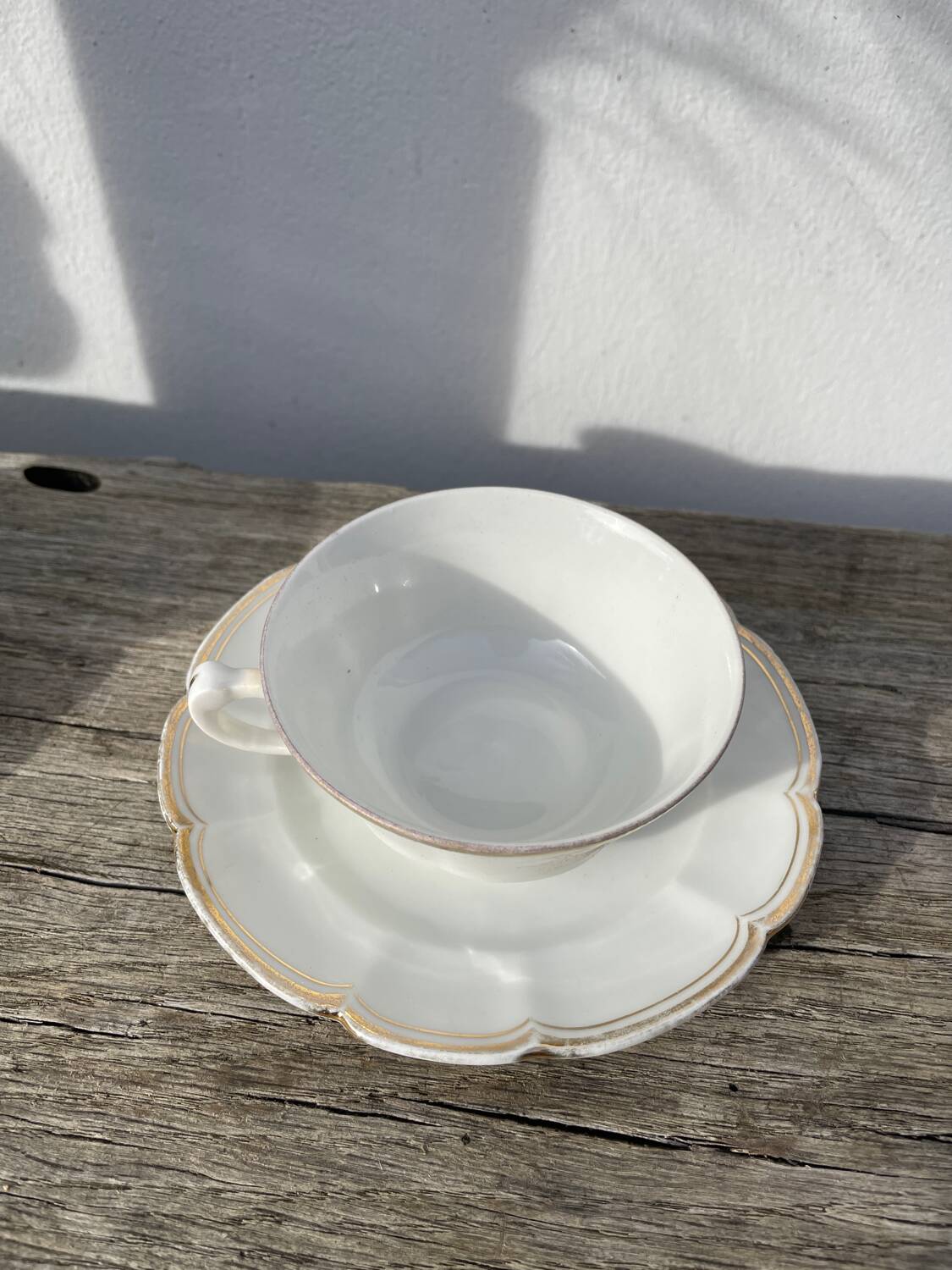 Pair of fine white and gold Limoges porcelain teacups
