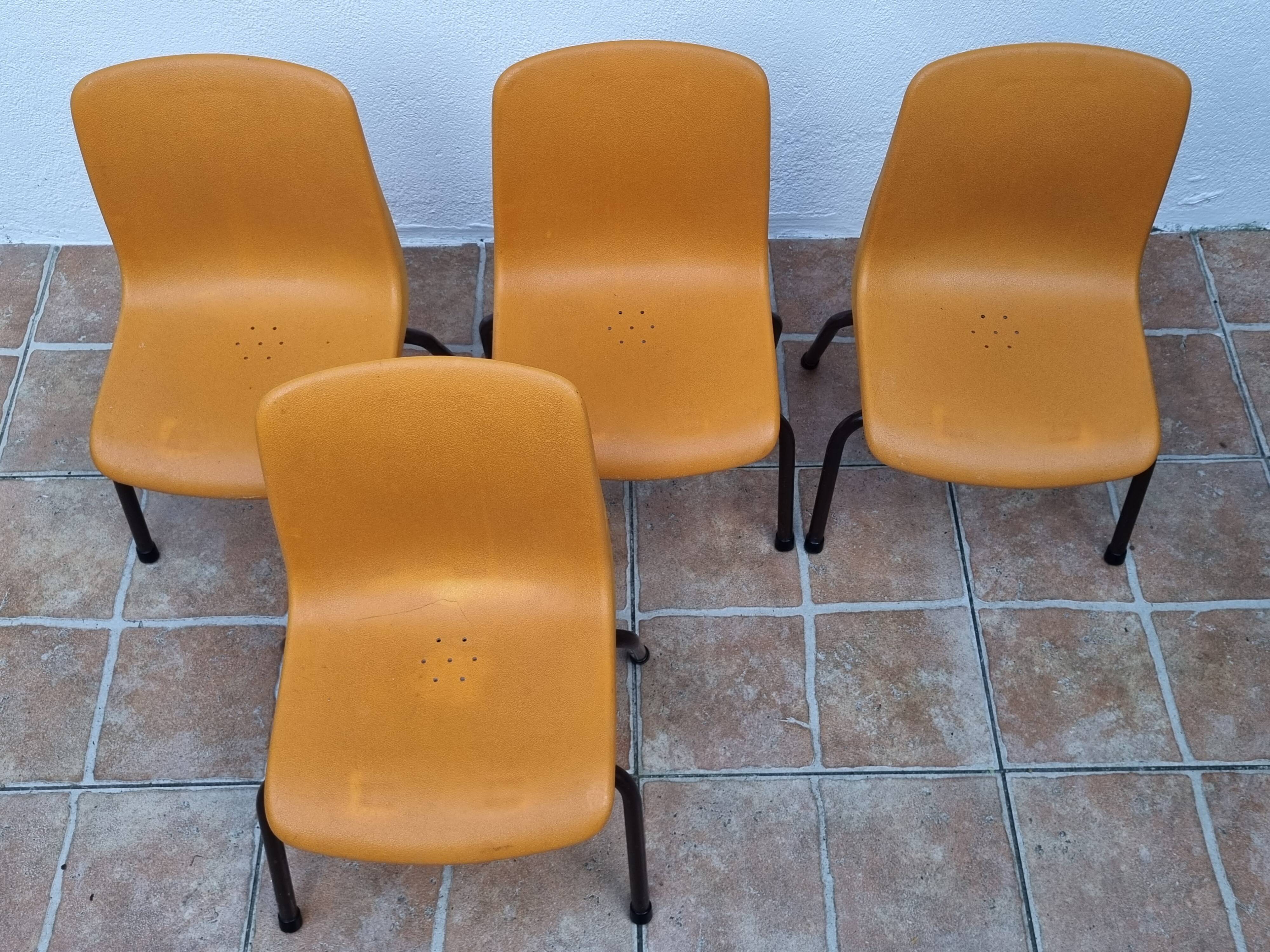 Set of 4 vintage Grosfillex school chairs, 60s-70s, orange plastic and tubular base