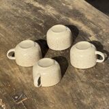 Set of 4 vintage speckled beige stoneware coffee cups.