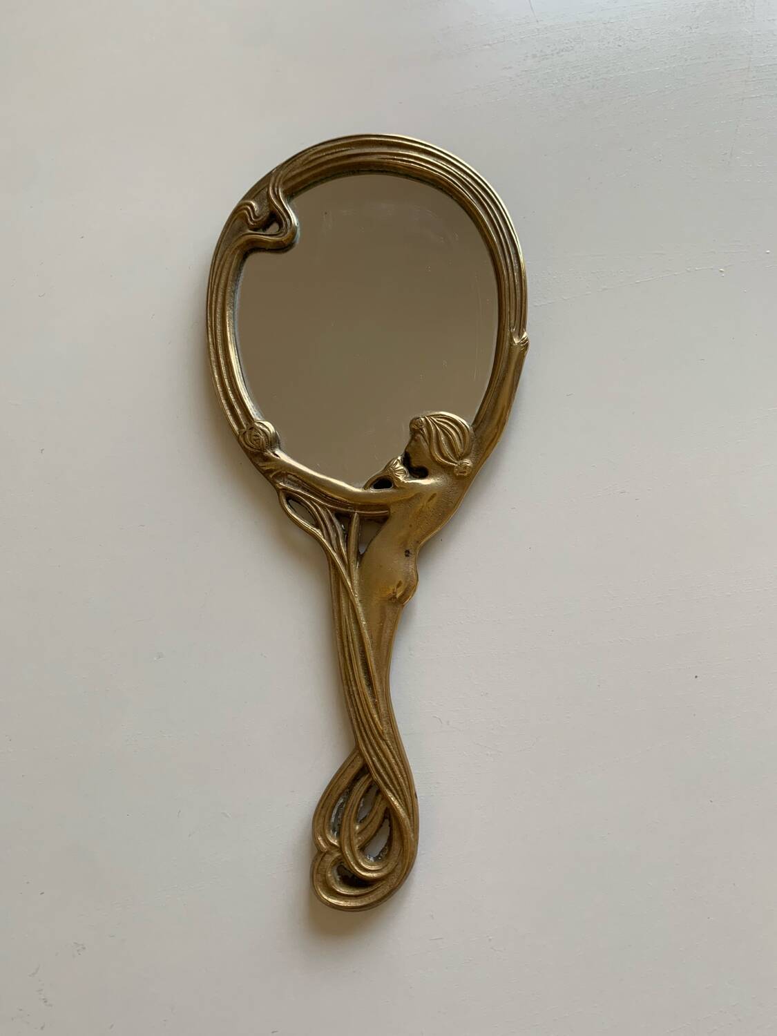Art Nouveau brass mirror for women